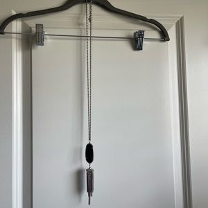 Long Kendra Scott necklace.